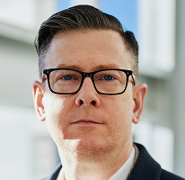 Führungskraft Alexander Hughes Porträtaufnahme CEO eines Krypto-Trading-Unternehmens